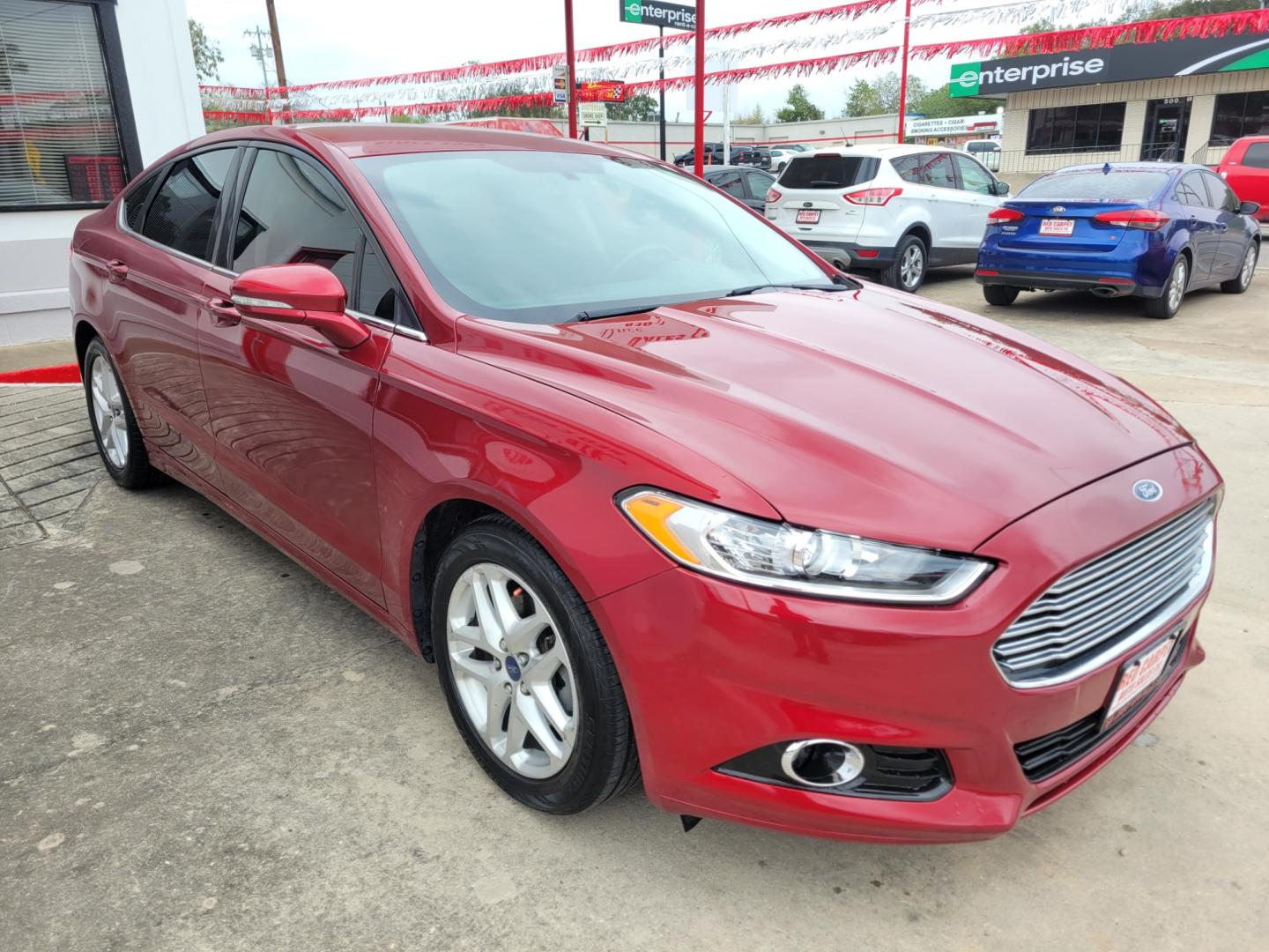 2013 Red Ford Fusion (3FA6P0HR3DR) with an 1.6L I4 F DOHC 16V engine, Automatic transmission, located at 503 West Court, Seguin, TX, 78155, (830) 379-3373, 29.568621, -97.969803 - Photo#1